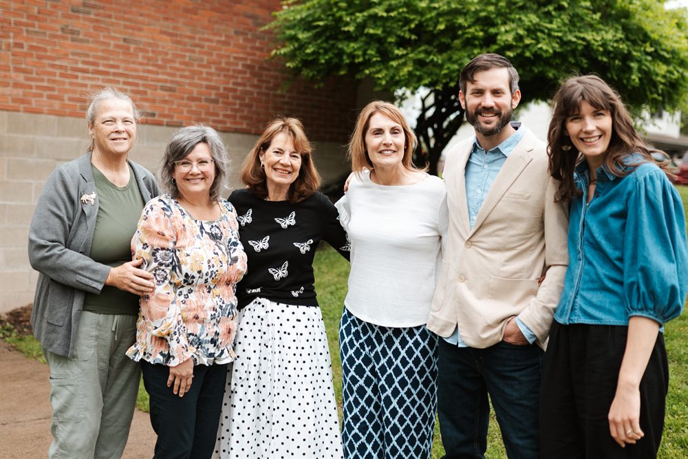 Members of the church standing together outside