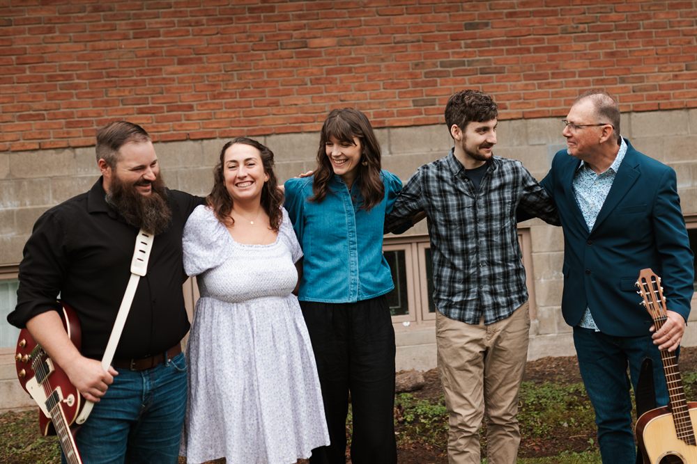Members of the worship team outside the church building