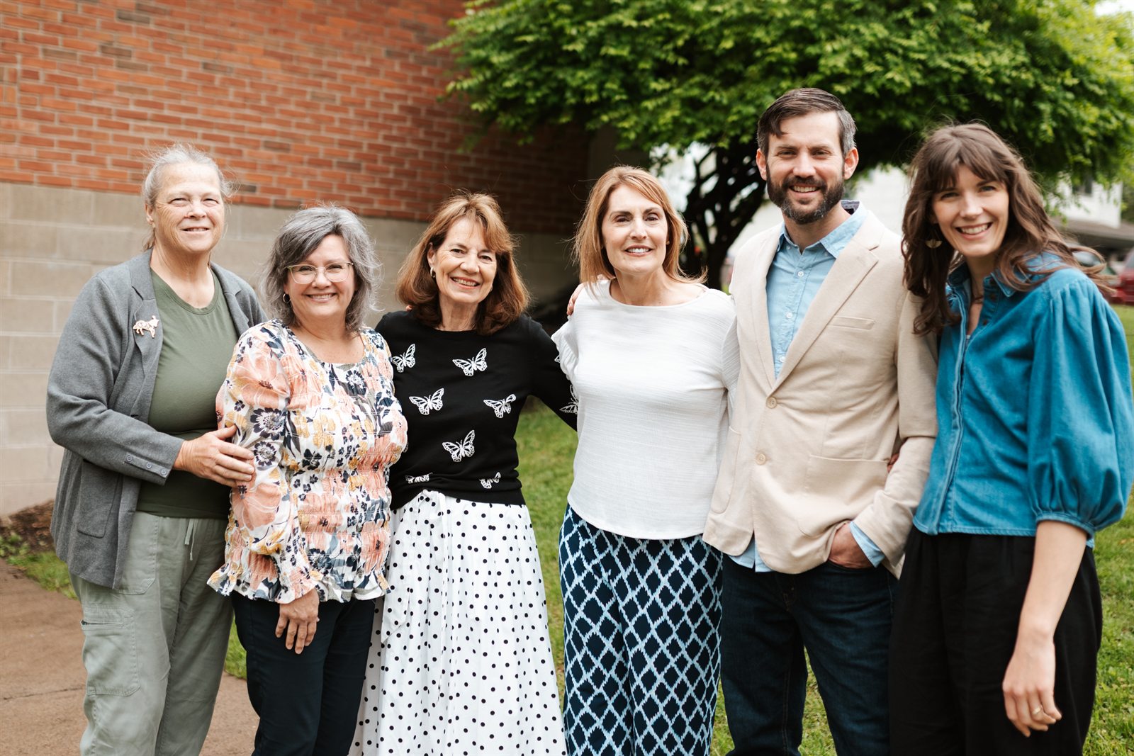 Members of United With Christ Church, Auburn, standing together outside
